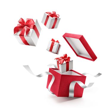 Red gift box with white presents and red ribbons floating out.