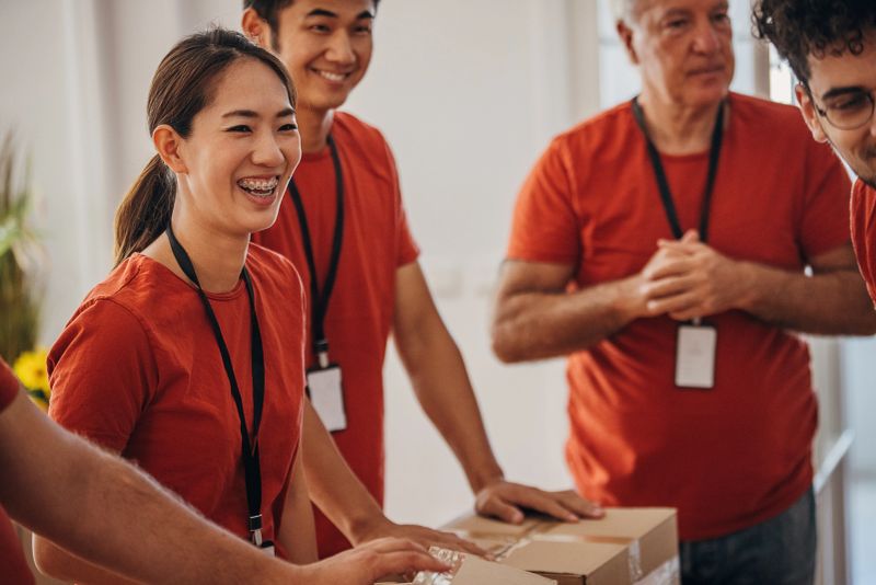 Group of volunteer packing donation boxes