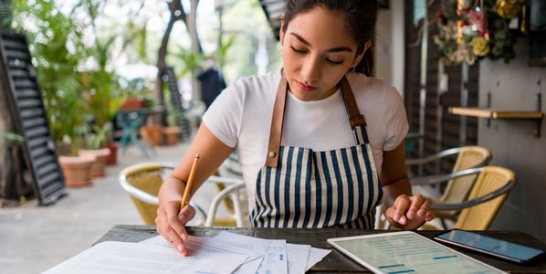 A professional reviewing financial documents.