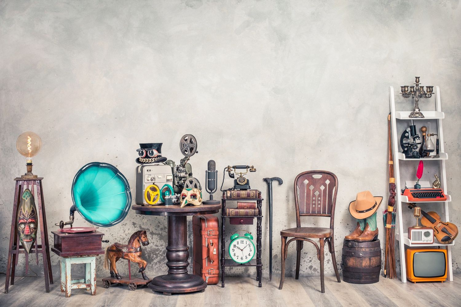 A collection of vintage items including gramophone, camera, typewriter, and old TV.