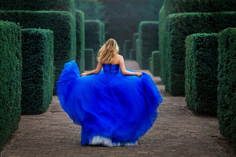 A beautiful blonde princess in a secret garden setting
