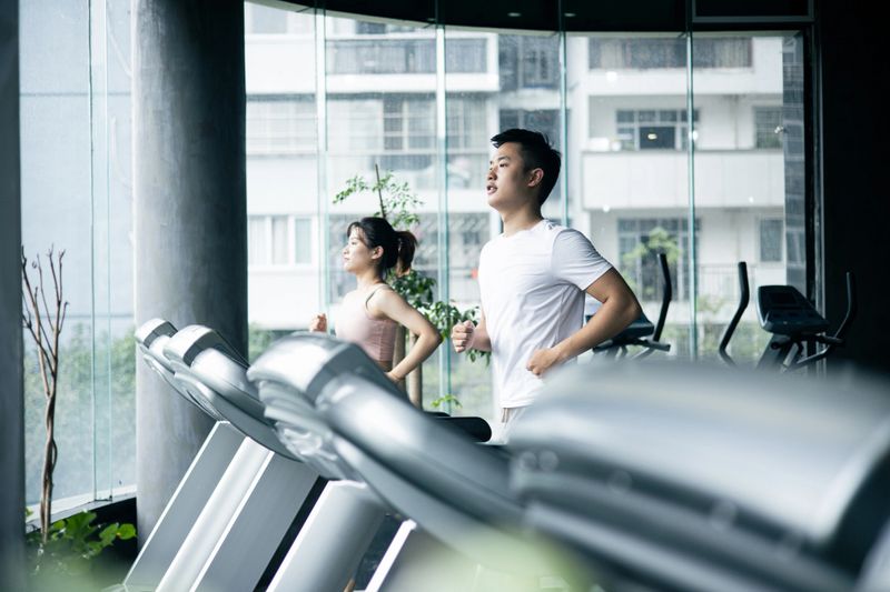 Couple working exercise on treadmill in gym