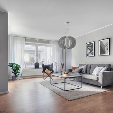 Modern living room with gray sofa and minimalist decor.