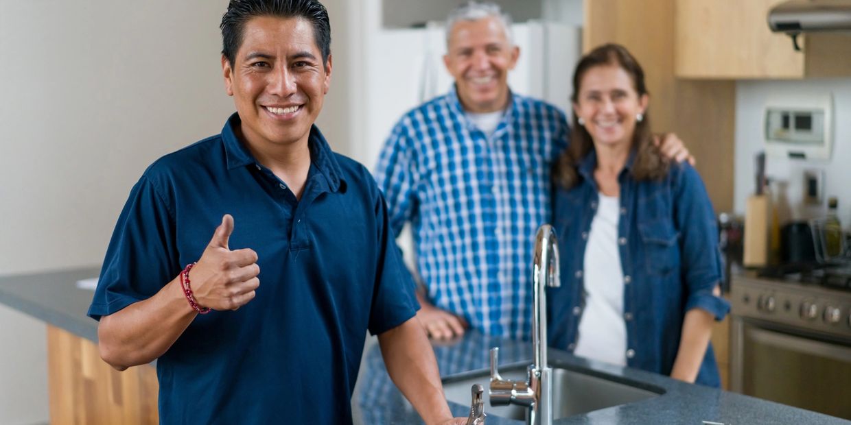 restoration technician helps happy customers