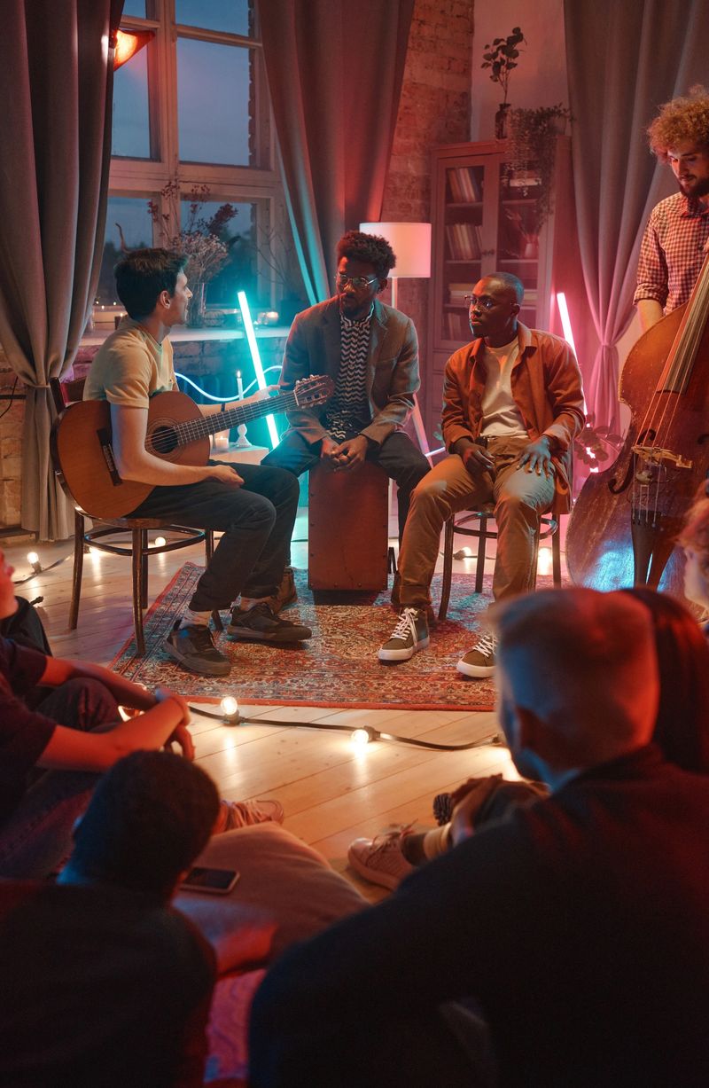 Music group of men discussing the beginning of their performance with fans sitting in front of them