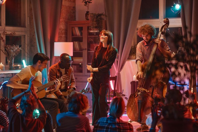 Music band with singer showing their performance for people in the night club