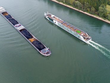 Serene river cruise with lush shoreline views