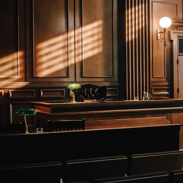 a court room with brown paneling