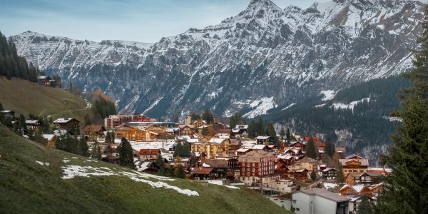 A picturesque mountain village nestled in the snow-capped Alps.