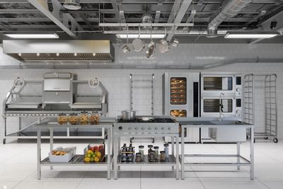 Modern industrial kitchen with stainless steel appliances and organized cooking stations.