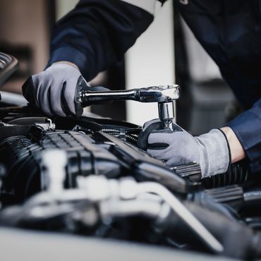 A person working on something in the car