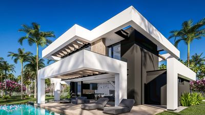 A modern house with pool and patio furniture.
