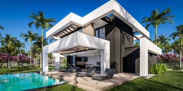 A modern house with pool and patio furniture.