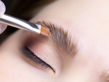 Woman receiving brow lamination in Everett, WA at Autumn Noel Esthetics.