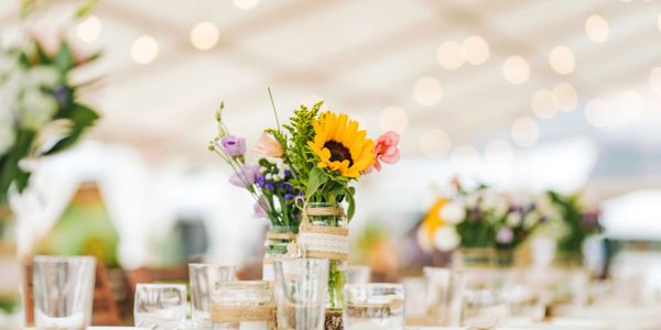 Sunflower centerpiece on a decorated table.