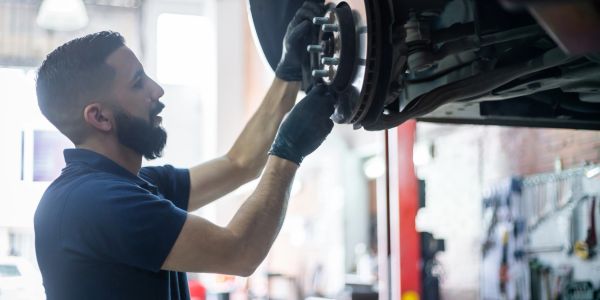 Mechanic fixing a car.