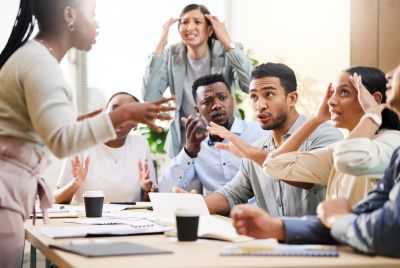 A heated discussion among coworkers in a meeting.