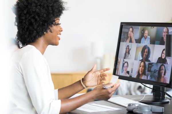 Woman engaging in a video conference call with colleagues.