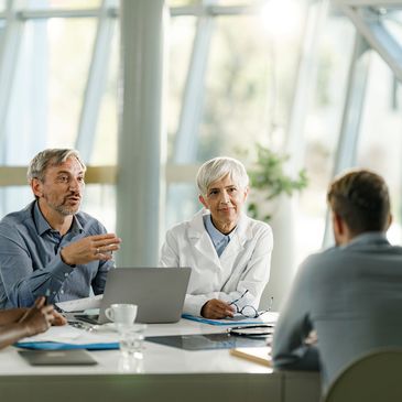 Healthcare advisors collaborating during a professional meeting.