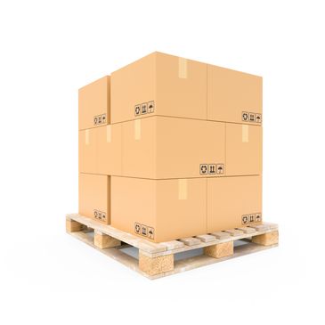 Stacked cardboard boxes on a wooden pallet isolated on white.