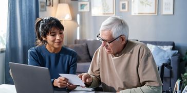 alert=" a personal is talking with a old man"