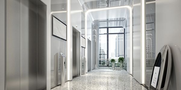 Modern elevator lobby with sleek design and bright lighting.
