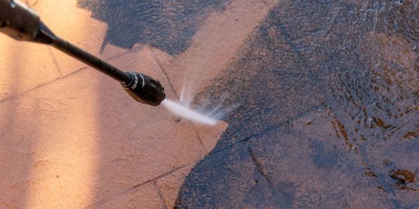 process of cleaning and pressure washing dirty concrete - Wash & Seal LLC Macomb County, MI