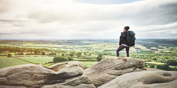 A man is standing on the rocks.
