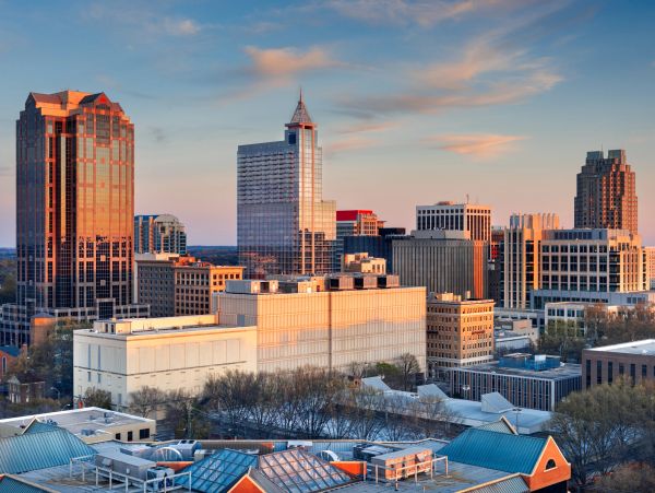 City skyline during sunset with modern buildings.