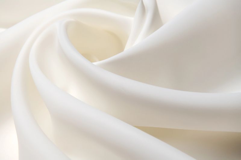 Background, texture. Template. Silk fabric, matte organza "Carolina", cream colors.