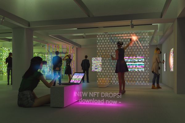 People interact with digital NFT displays in a modern gallery.