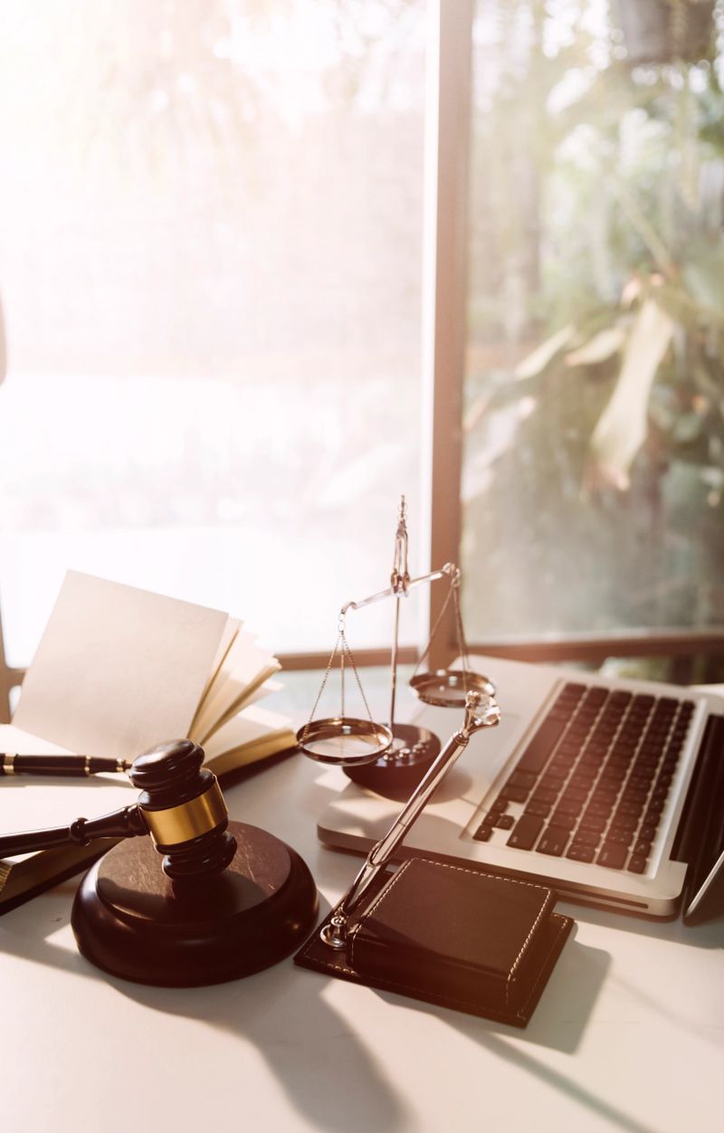 Business and lawyers discussing contract papers with brass scale on desk in office. Law, legal services, advice, justice and law concept