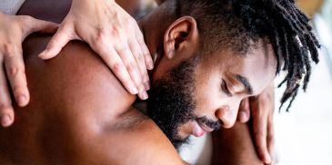 Man receiving a shoulder massage.