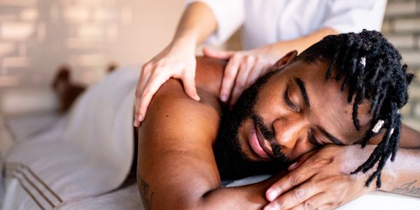 Man receiving a shoulder massage.