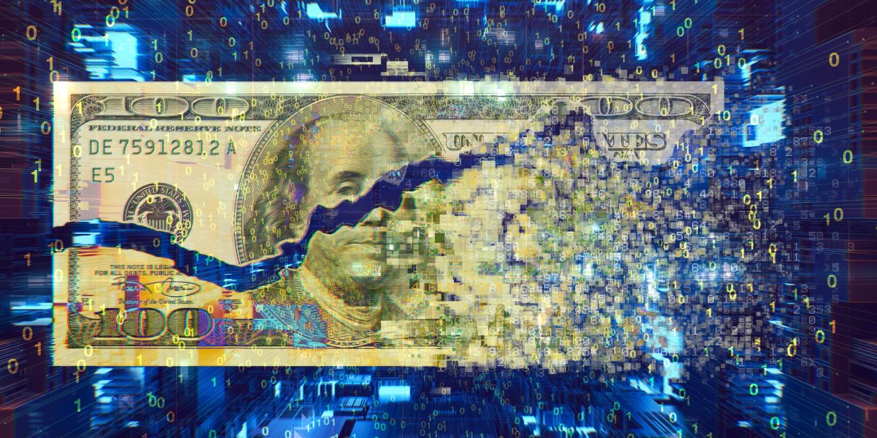 Digital data dissolving a $100 bill.