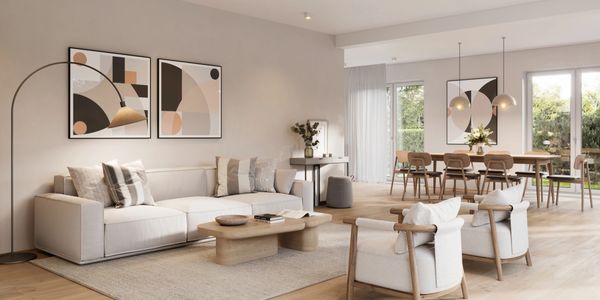 Modern living room with neutral tones and abstract art.