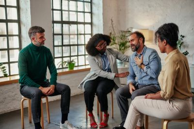 Group therapy session with empathetic support.