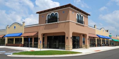 New empty commercial building with an outdoor walkway.