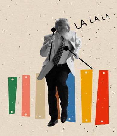 Man with mallets playing colorful bars, singing.