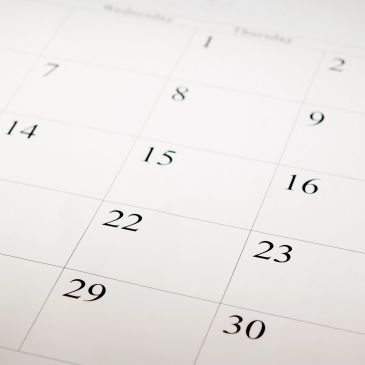 Close-up of a calendar showing dates for our events.