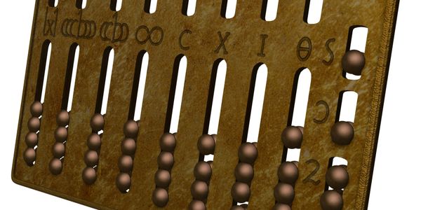 An ancient abacus with Greek numerals and beads for calculation.