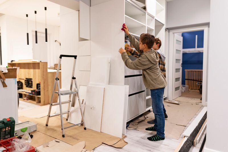 Teenage boys are cleaning just installed furniture. Boys are cleaning the cabinets and wardrobes.
Shot with Canon R5