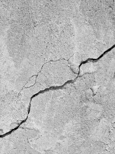 Cracked concrete surface.