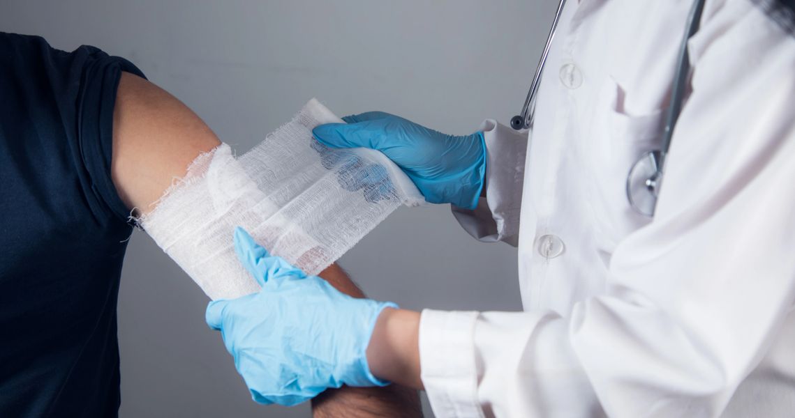 Wound care specialist treating patient at home in Metro Detroit Michigan