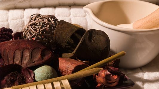 Woman enjoying a relaxing massage with aromatic oils at a spa.