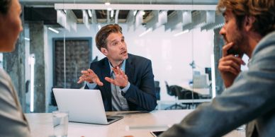 Businessman explaining a point in a meeting.