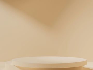 Minimalist beige round pedestal against soft background.