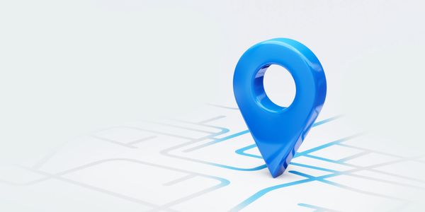 Blue location pin marker on a simplified map background.