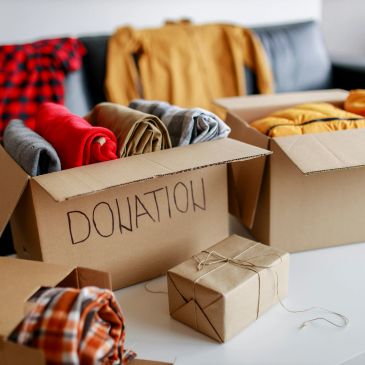 Boxes of clothes for donation ready to be given away.