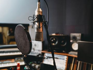 Professional microphone setup in a music recording studio.
